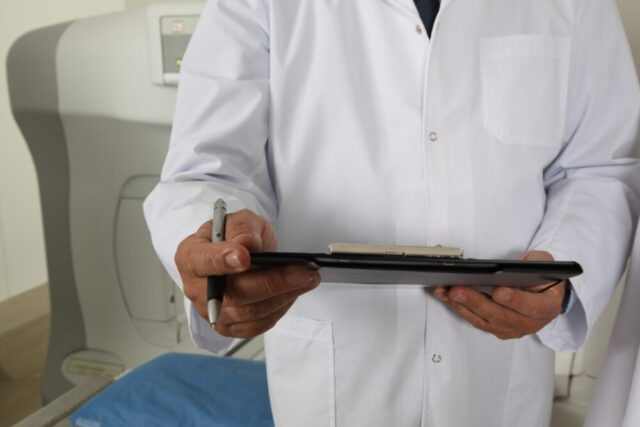 doctor writing notes