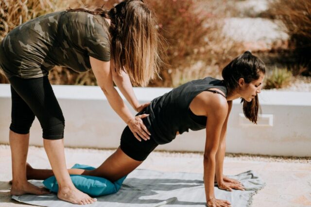 yoga instructor student