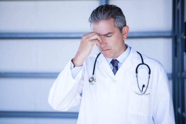 doctor appearing distressed