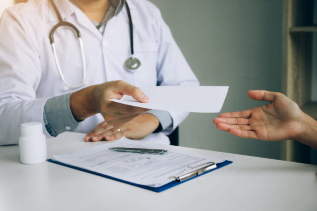 doctor giving documents