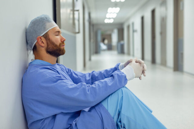 surgeon sitting dowm