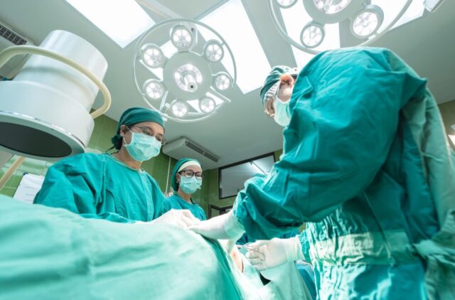 doctors performing surgery