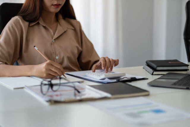woman calculating expenses