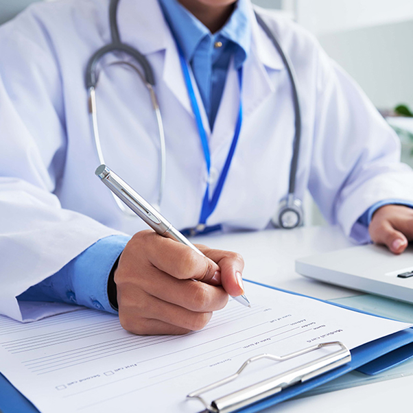 doctor filling out a form